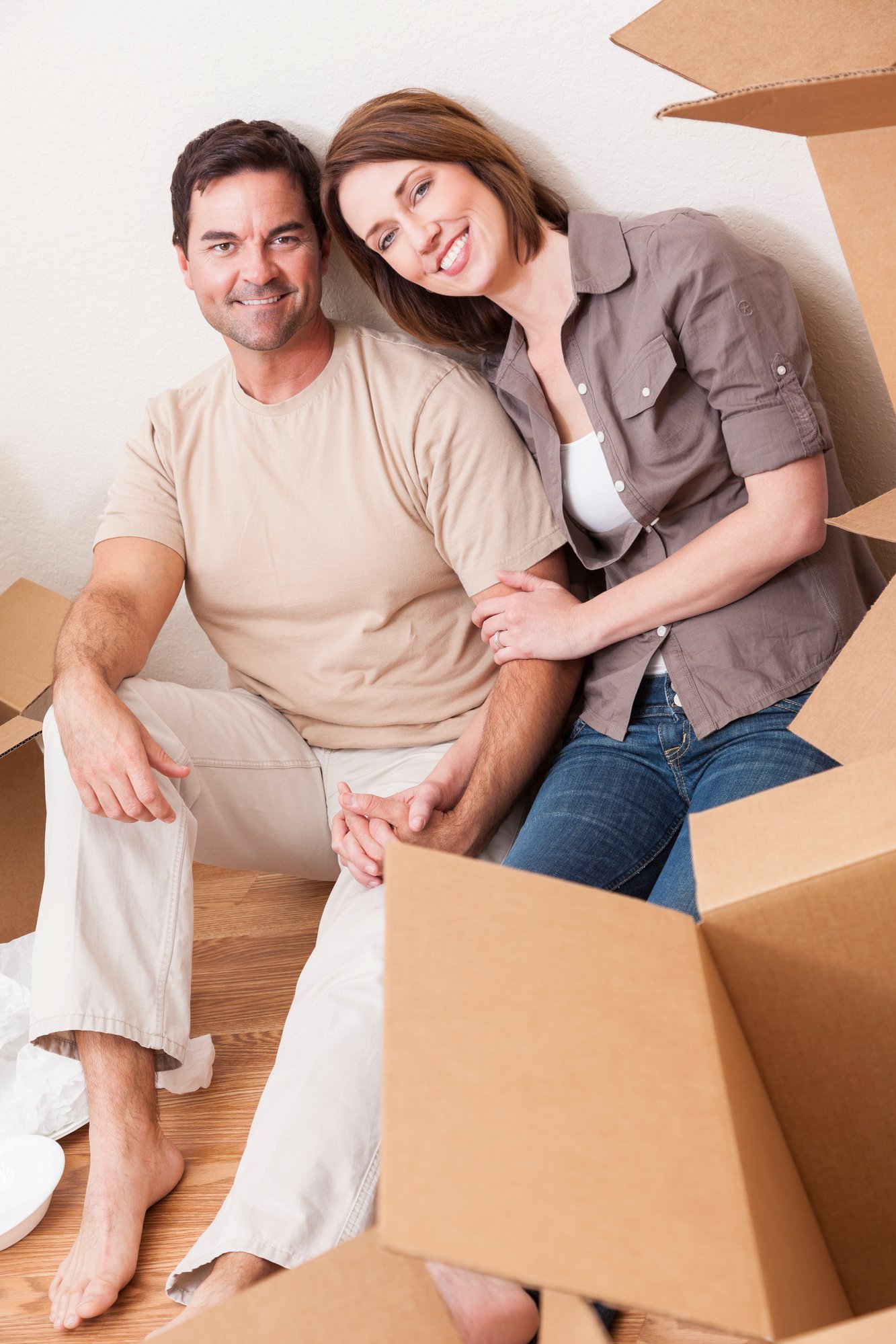 Middle age couple with moving boxes